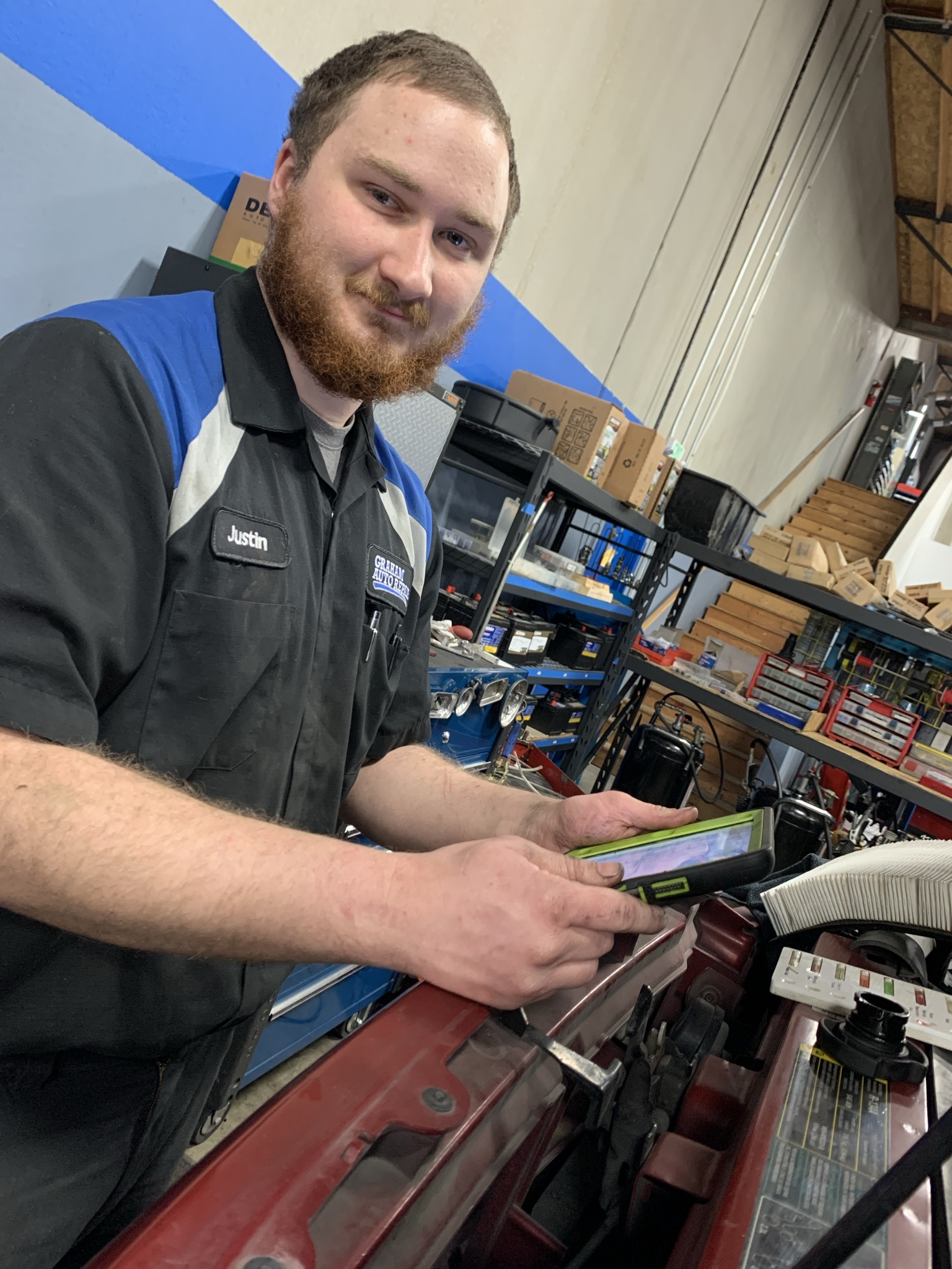 Mechanic Performing a Digital Vehicle Inspection at Graham Auto Repair